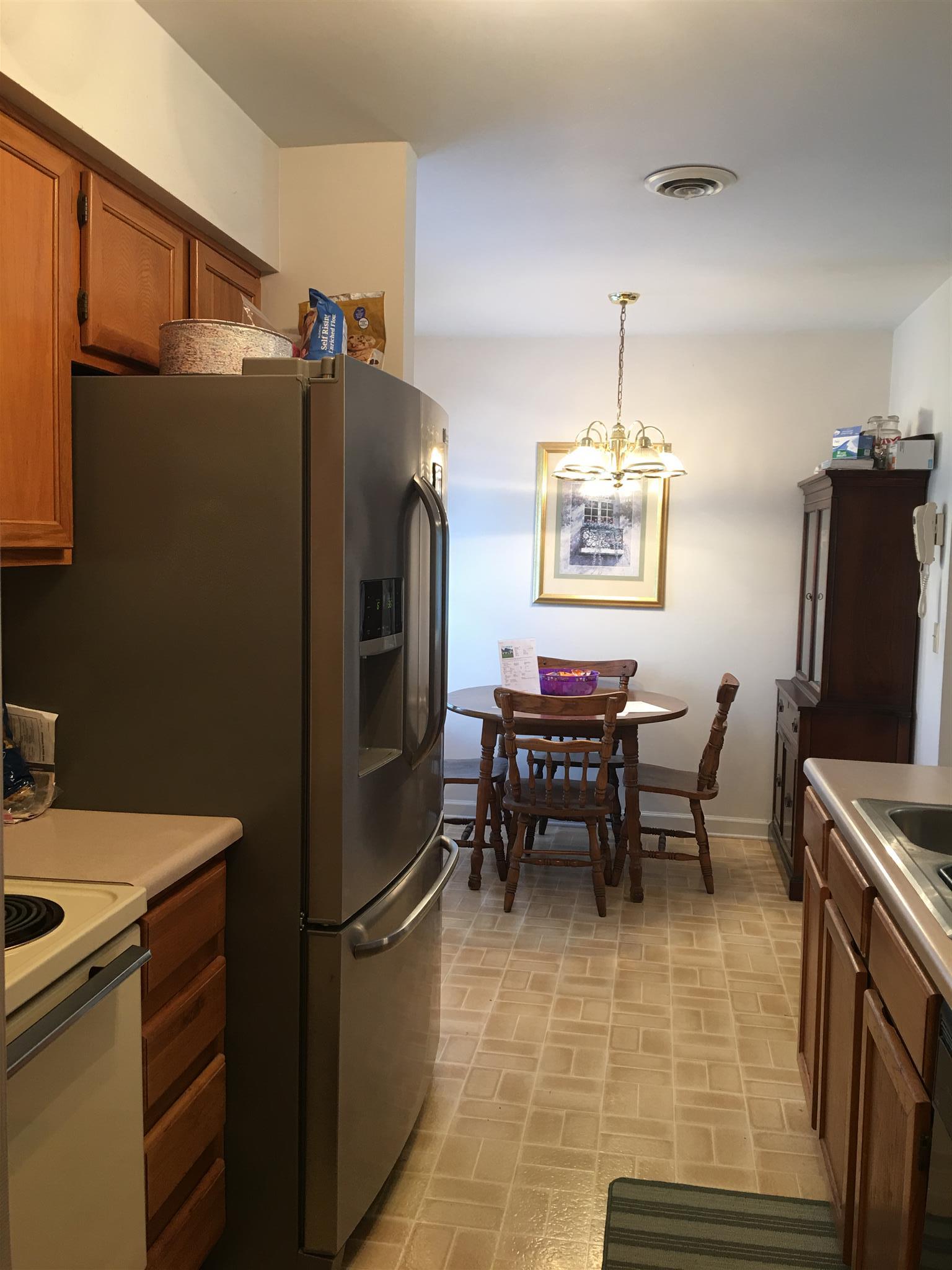 1241 Cheyenne Boulevard Madison, TN 37115 - Photo 8 of 16 a kitchen with stainless steel appliances granite countertop a refrigerator and a stove top oven