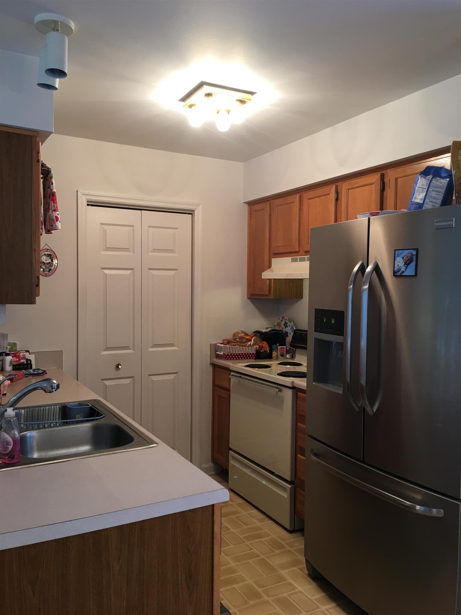 1241 Cheyenne Boulevard Madison, TN 37115 - Photo 9 of 16 a kitchen with a refrigerator sink and cabinets