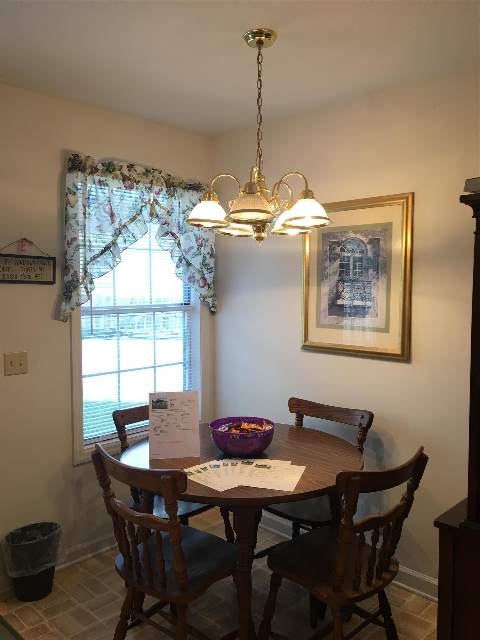 1241 Cheyenne Boulevard Madison, TN 37115 - Photo 10 of 16 a view of a dining room with a table and chairs