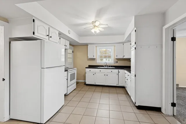 a kitchen with a refrigerator a sink and dishwasher