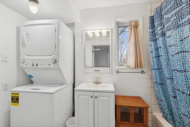a bathroom with a sink toilet and mirror