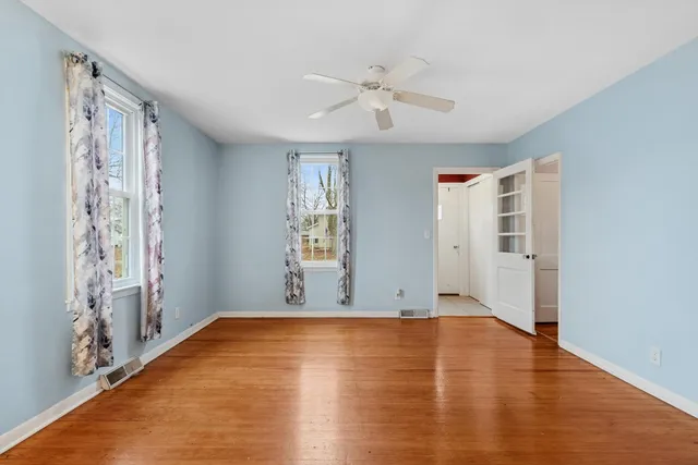 a view of room with window and hardwood floor
