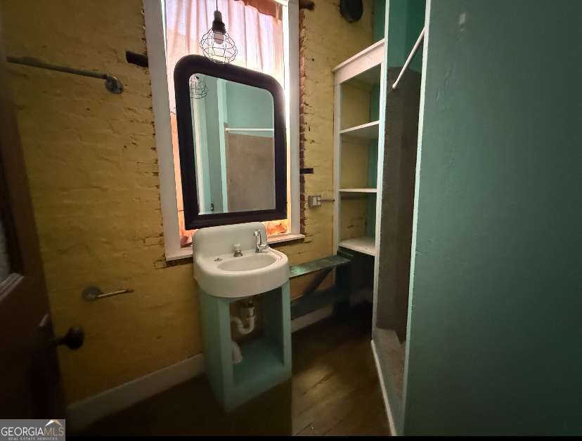 359 Railroad Street, Unit F Royston, GA 30662 - Photo 3 of 9 a bathroom with a sink and mirror