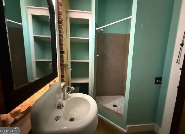 a bathroom with a tub and a sink