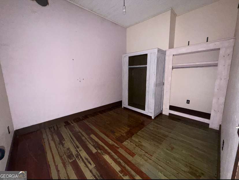 359 Railroad Street, Unit F Royston, GA 30662 - Photo 7 of 9 a view of an empty room with closet and a window