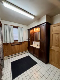 a kitchen with wooden cabinets and a sink