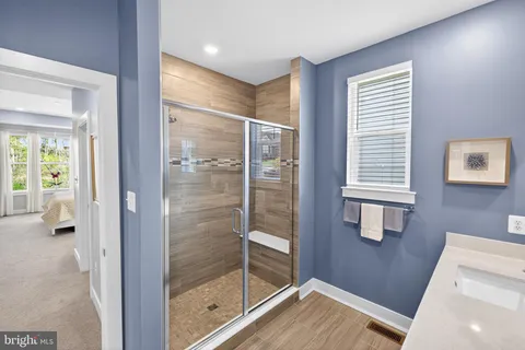 a bedroom with furniture and a flat screen tv