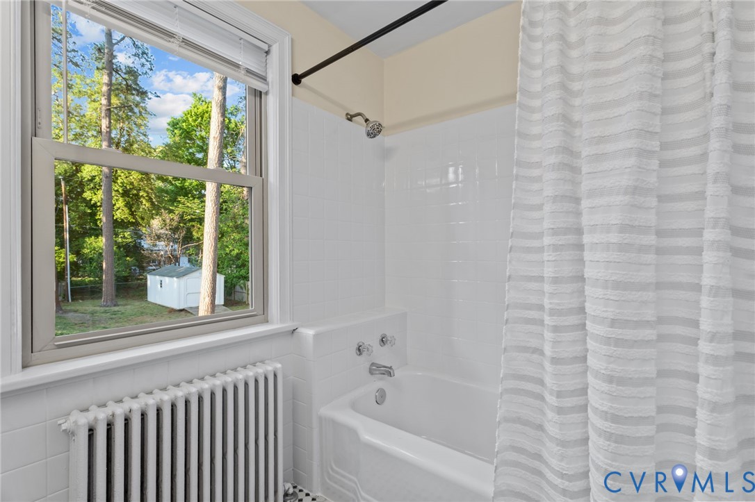 4804 Morrison Road Richmond, VA 23230 - Photo 35 of 48 a bathroom with a bathtub and a shower
