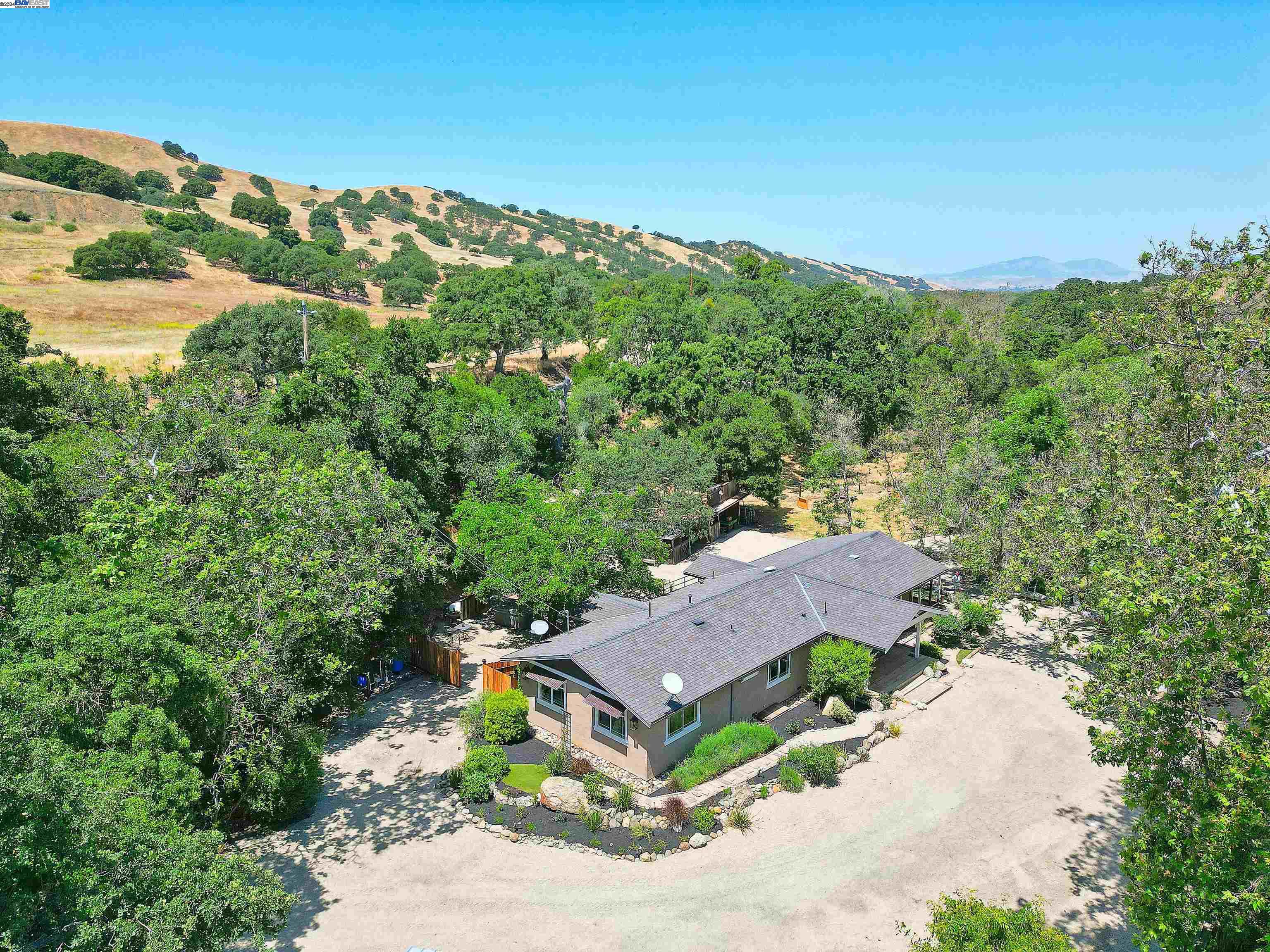 an aerial view of a house with mountain view