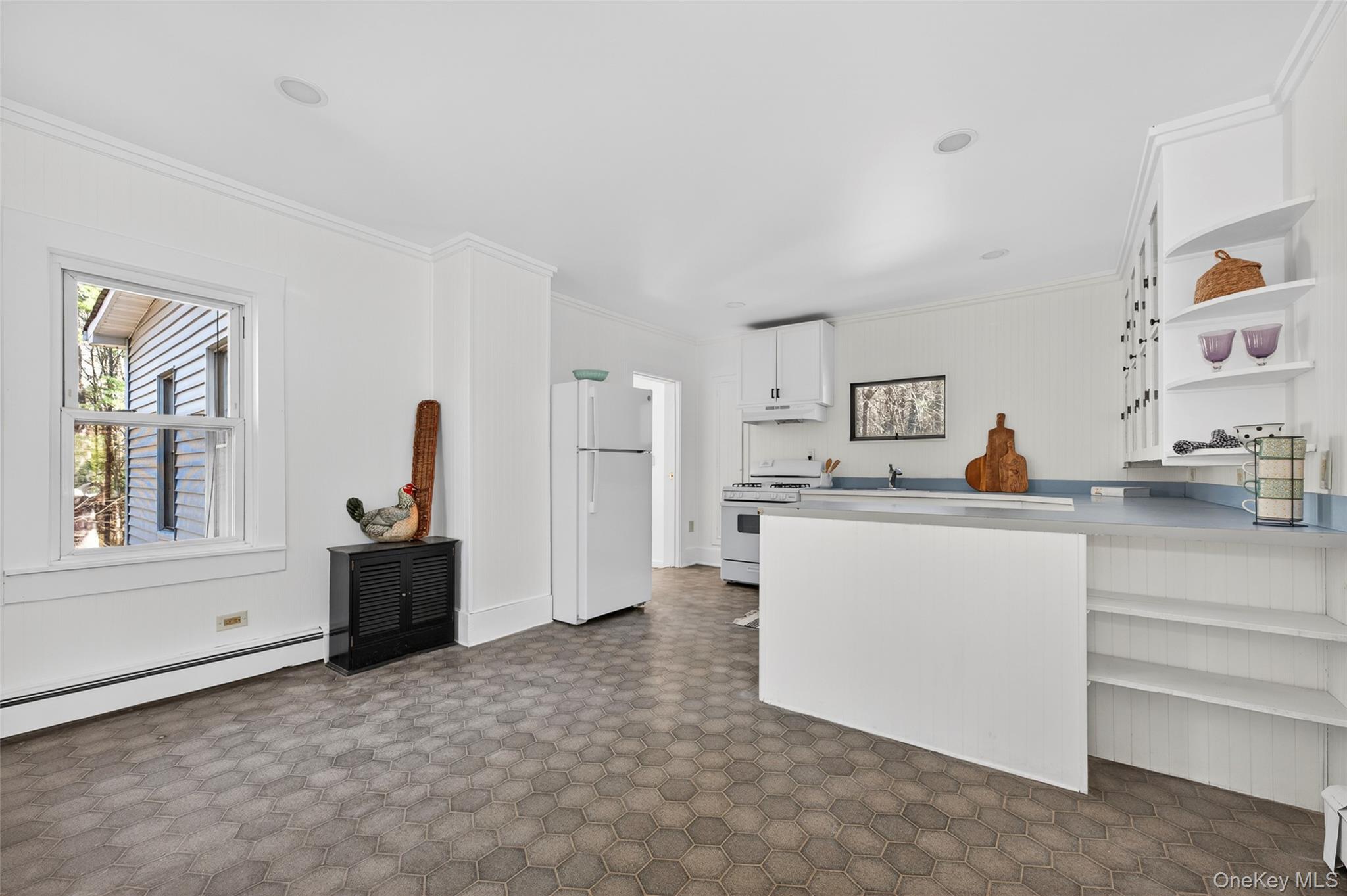 7 Highland Lake Road Eldred, NY 12732 - Photo 12 of 19 a living room with furniture a refrigerator and kitchen