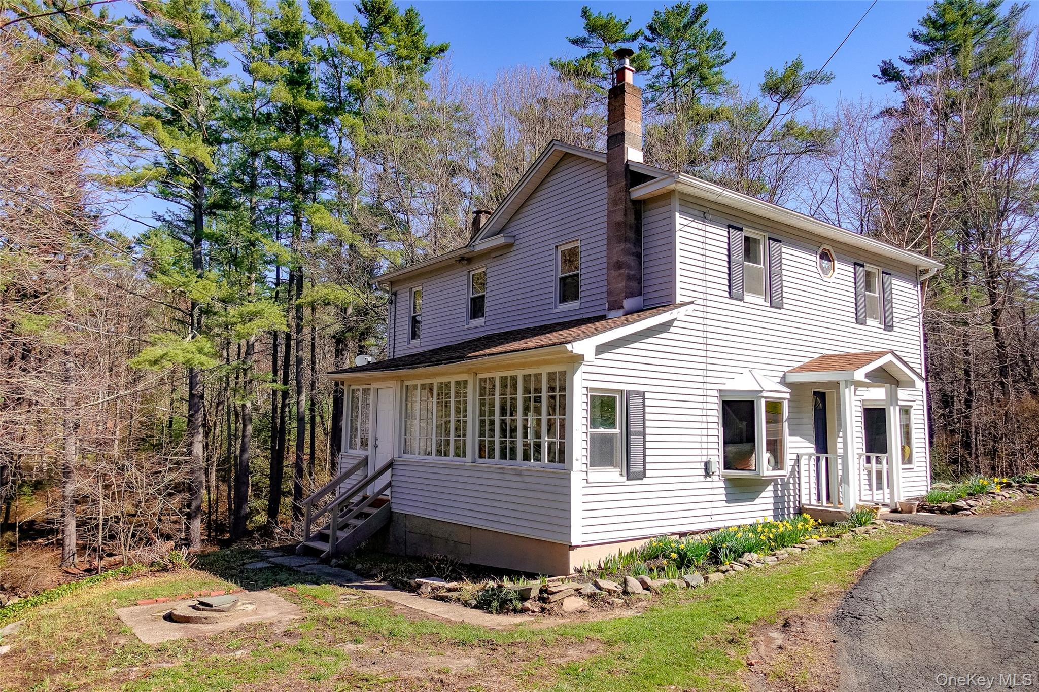 7 Highland Lake Road Eldred, NY 12732 - Photo 2 of 19 a front view of a house with a yard tree and a yard
