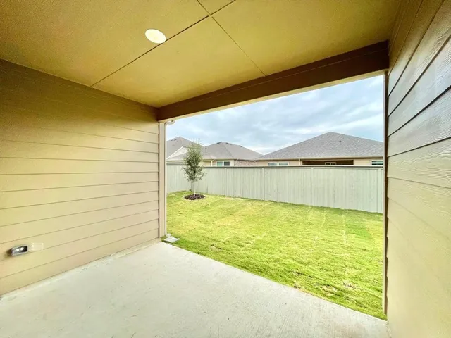 a view of a swimming pool and an outdoor space