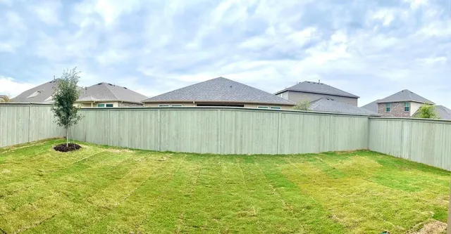 a view of a big yard with an outdoor space