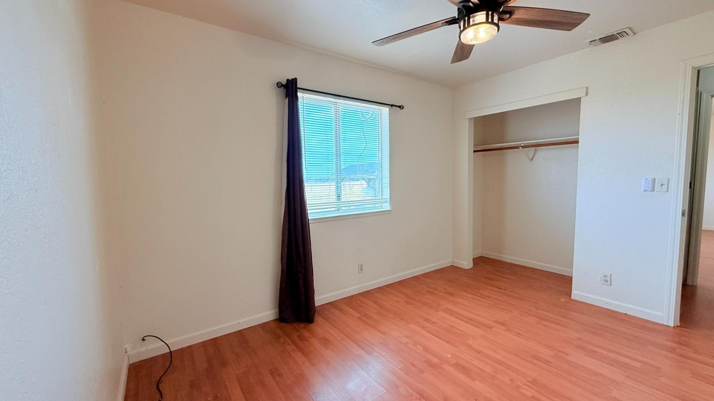 7947 Camp Far West Road Wheatland, CA 95692 - Photo 14 of 32 wooden floor in an empty room with a window