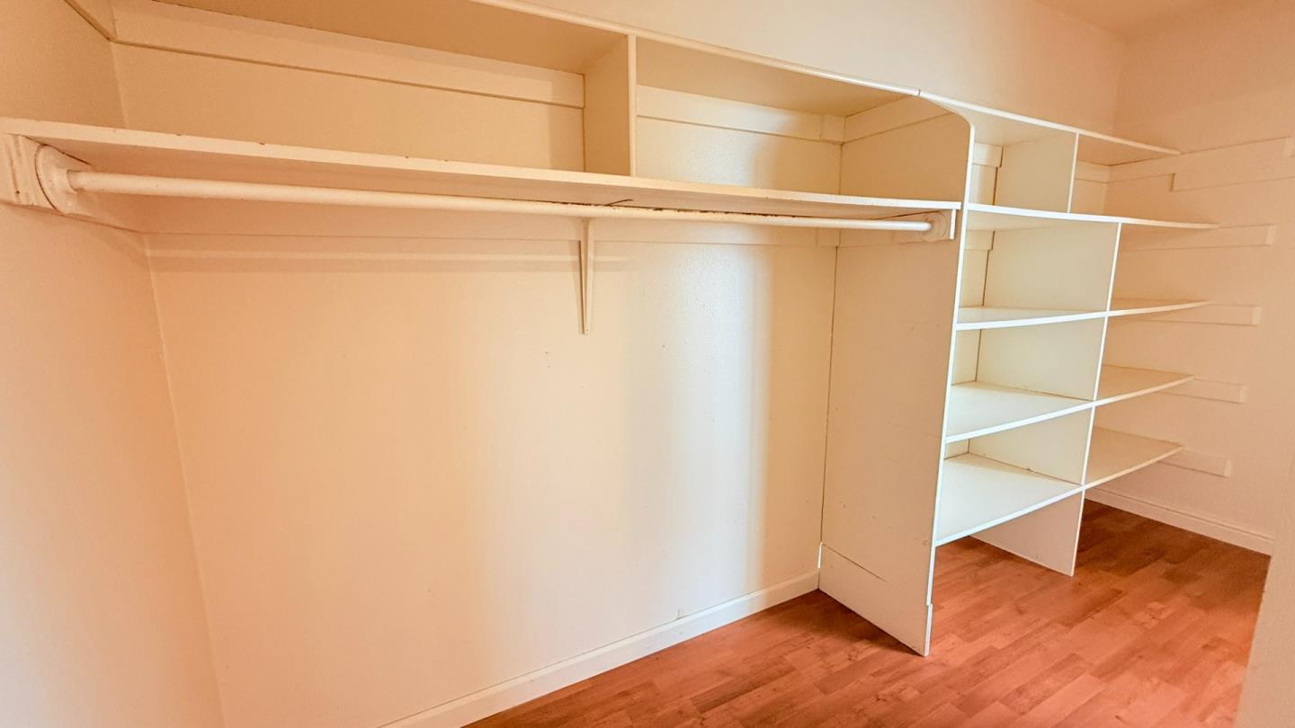 7947 Camp Far West Road Wheatland, CA 95692 - Photo 20 of 32 a view of an empty room with wooden floor and a window