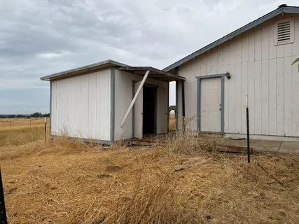 a house view with a outdoor space