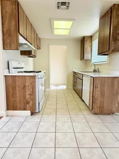 a bathroom with a sink a mirror and a vanity