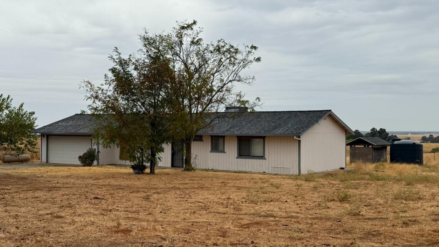 7947 Camp Far West Road Wheatland, CA 95692 - Photo 9 of 32 a view of a house with a yard