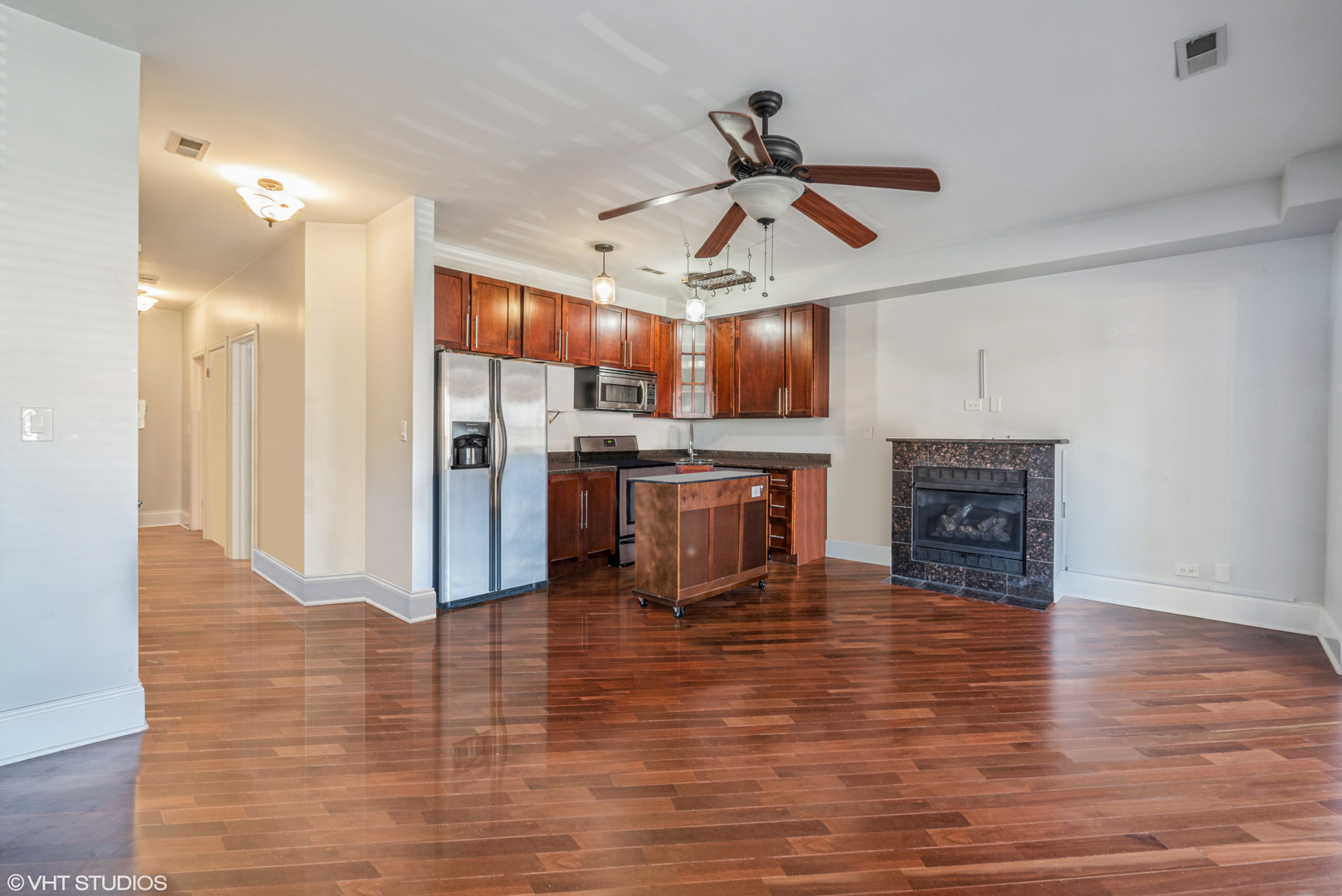 4819 South Prairie Avenue, Unit 2 Chicago, IL 60615 - Photo 3 of 10 a view of a kitchen with a stove cabinets and wooden floor