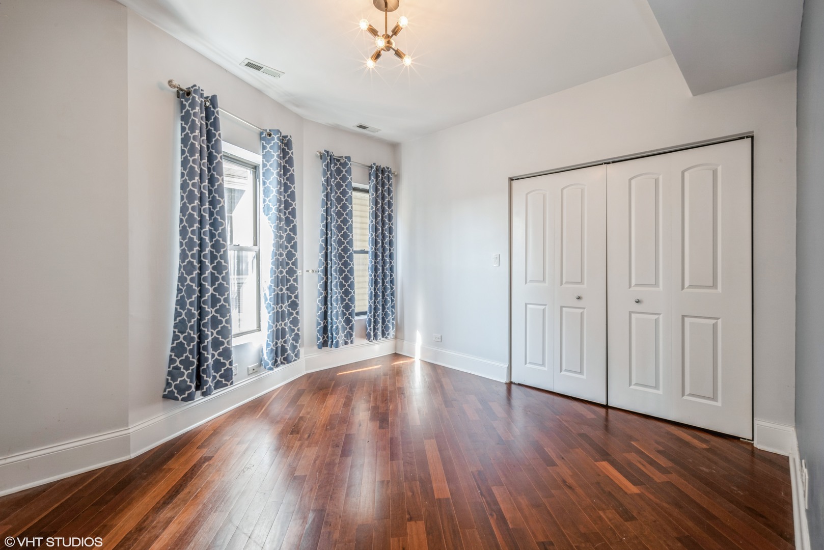4819 South Prairie Avenue, Unit 2 Chicago, IL 60615 - Photo 5 of 10 wooden floor in an empty room with a window
