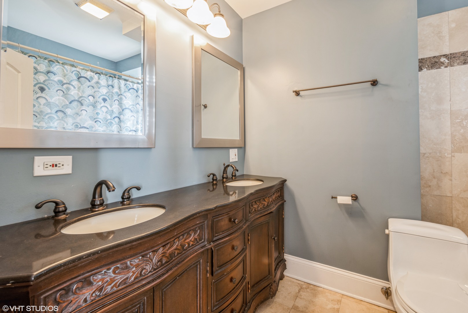 4819 South Prairie Avenue, Unit 2 Chicago, IL 60615 - Photo 6 of 10 a bathroom with a granite countertop sink toilet and a mirror