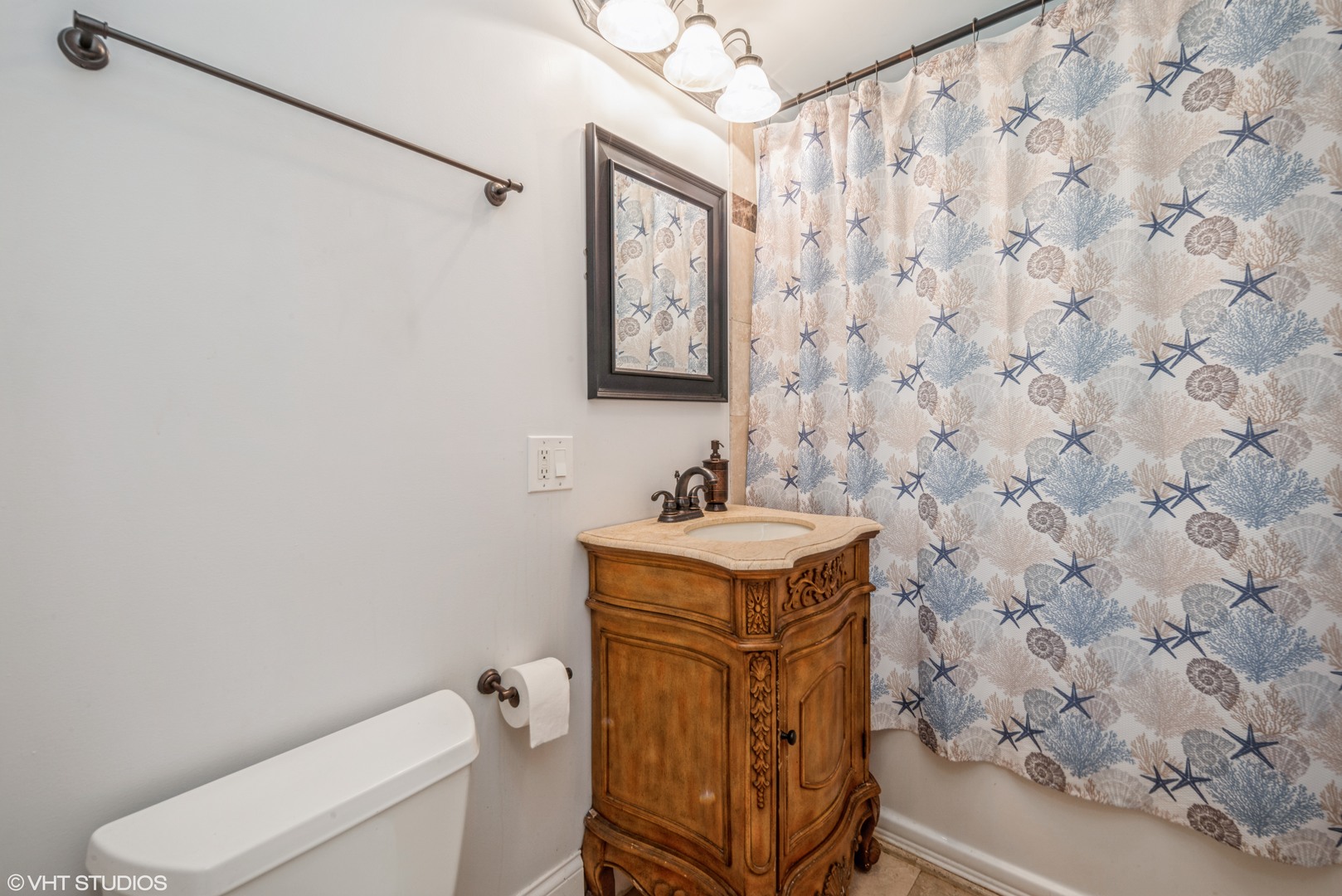 4819 South Prairie Avenue, Unit 2 Chicago, IL 60615 - Photo 9 of 10 a bathroom with a sink a toilet and mirror
