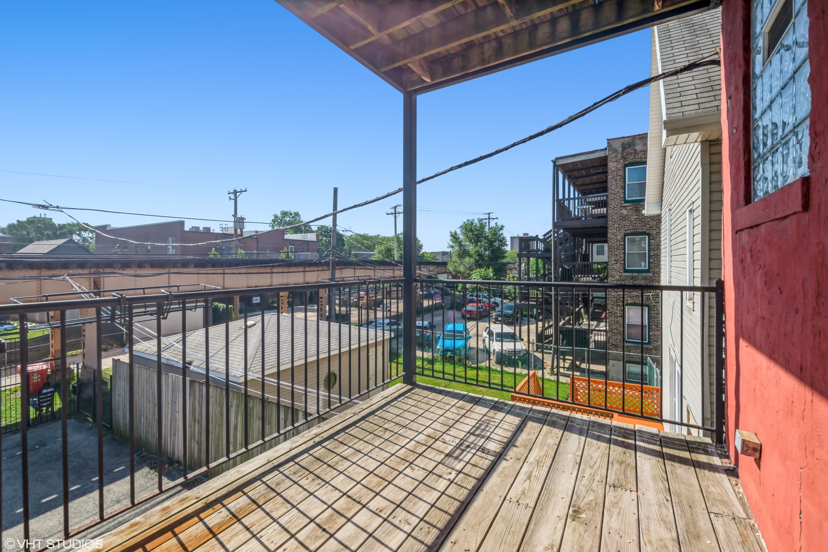 4819 South Prairie Avenue, Unit 2 Chicago, IL 60615 - Photo 10 of 10 a view of a balcony with wooden floor and fence