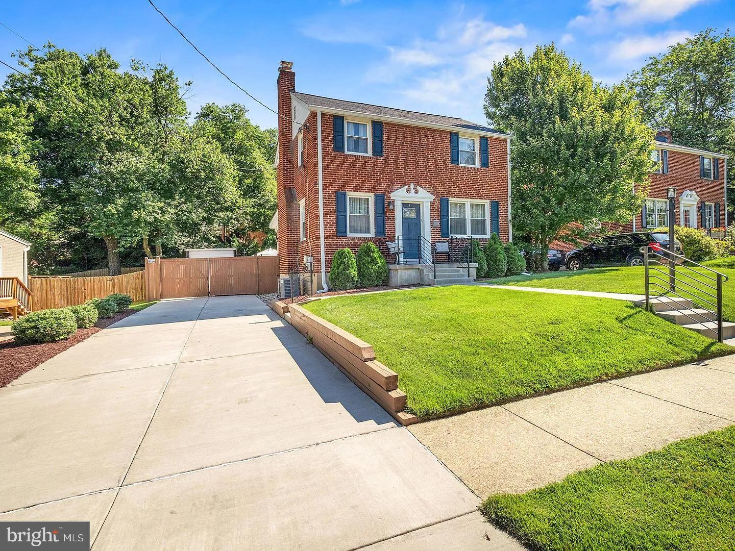 2605 Arcola Avenue Silver Spring, MD 20902 - Photo 3 of 30 Charming brick home with lush greenery.