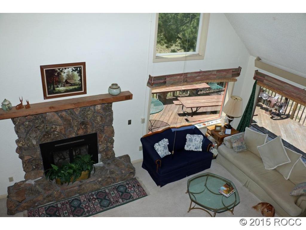 159 Kankakee Road Westcliffe, CO 81252 - Photo 12 of 22 a living room with furniture and a fireplace