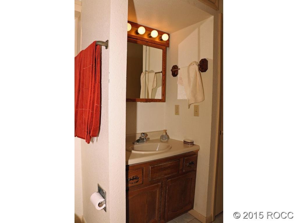159 Kankakee Road Westcliffe, CO 81252 - Photo 18 of 22 a bathroom with a sink and a mirror