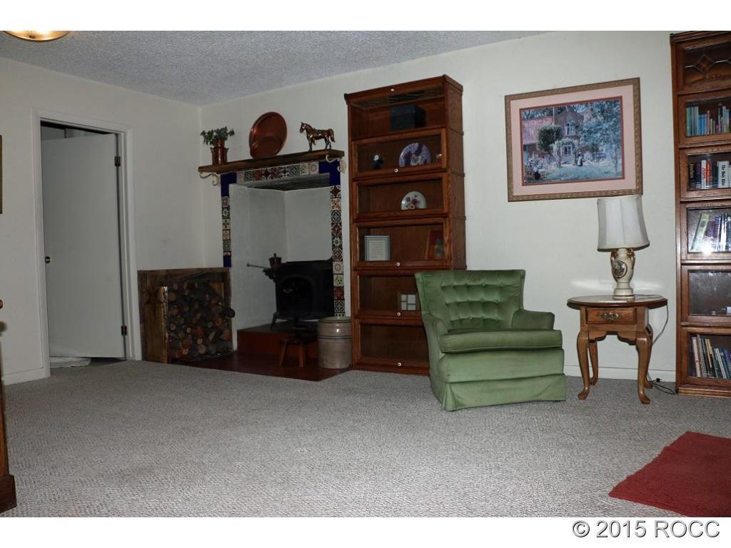 159 Kankakee Road Westcliffe, CO 81252 - Photo 19 of 22 a living room with furniture and a fireplace