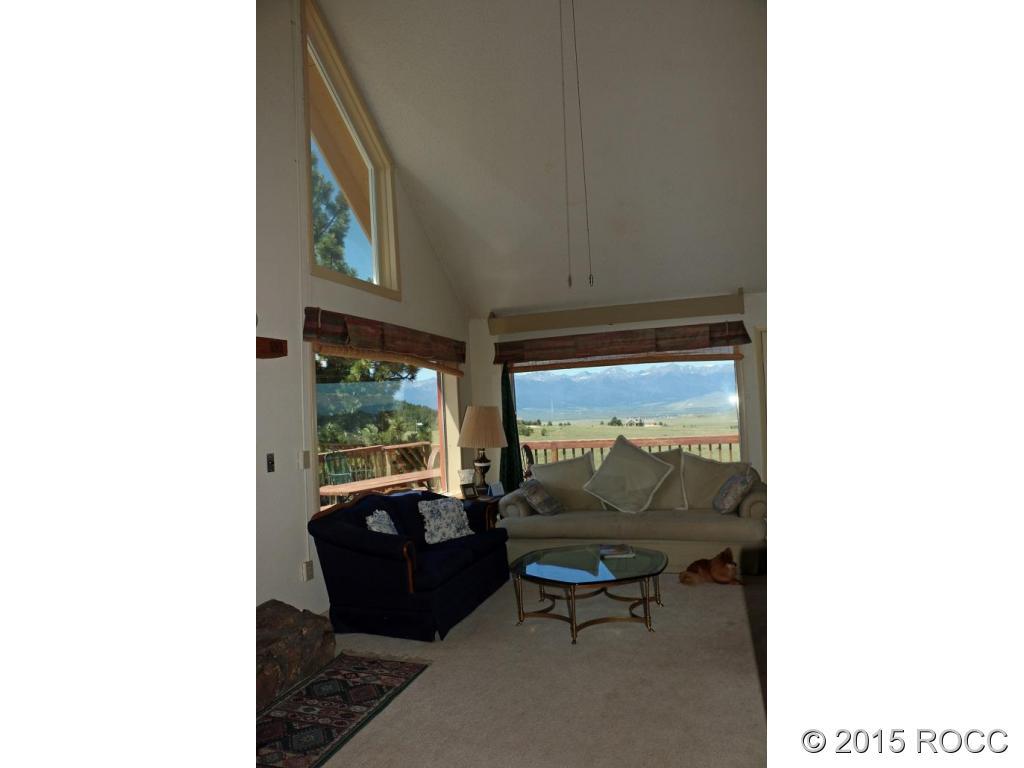 159 Kankakee Road Westcliffe, CO 81252 - Photo 20 of 22 a living room with furniture and a large window
