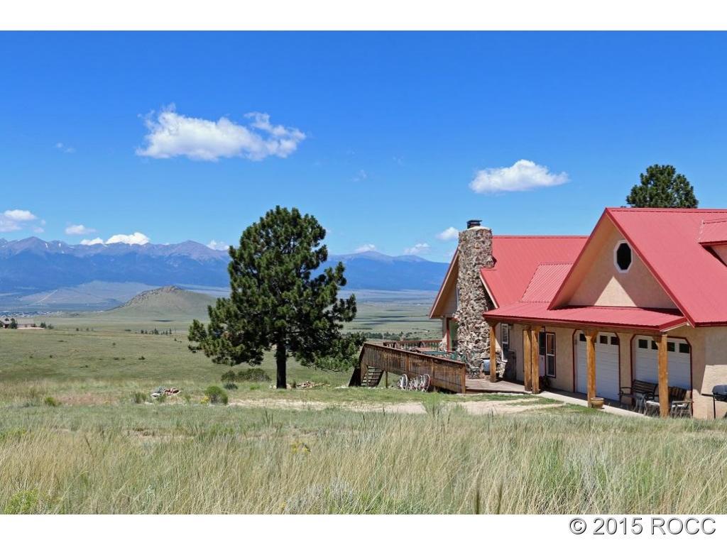 159 Kankakee Road Westcliffe, CO 81252 - Photo 22 of 22 a backyard of a house with table and chairs