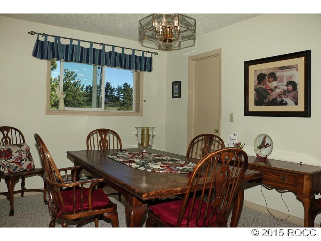 159 Kankakee Road Westcliffe, CO 81252 - Photo 5 of 22 a bathroom with a sink a mirror and a painting on the wall