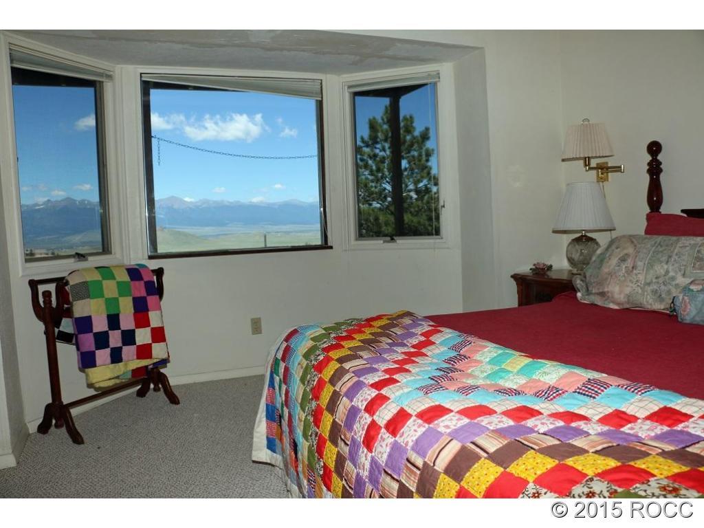 159 Kankakee Road Westcliffe, CO 81252 - Photo 6 of 22 a bedroom with a bed and dresser