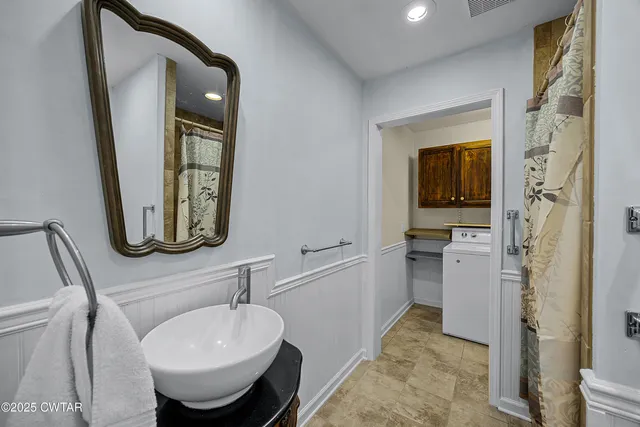 a bathroom with a sink and a mirror