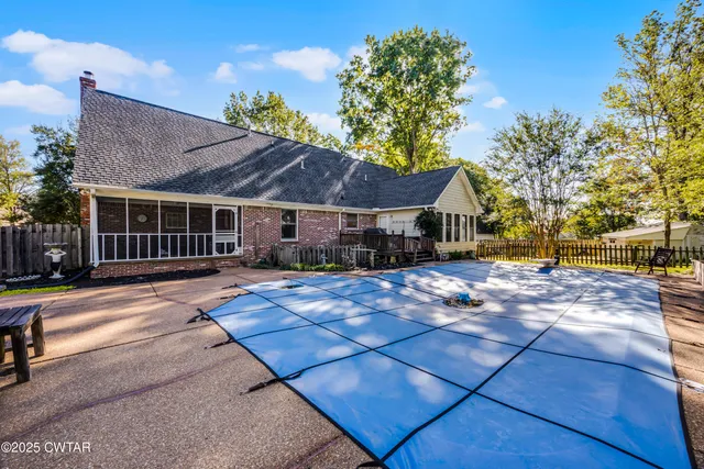 a house with trees in the background