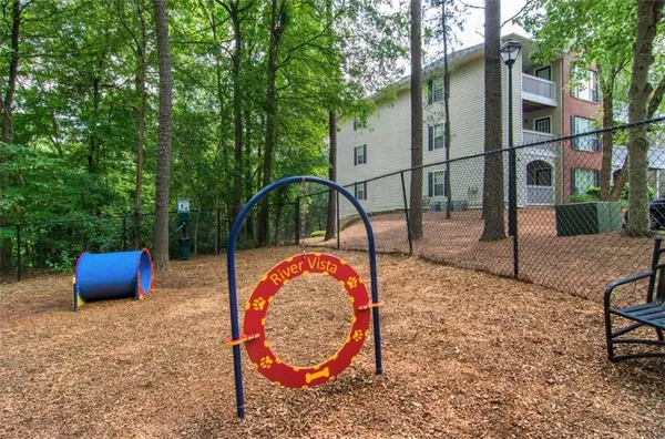 a view of a backyard with sitting area