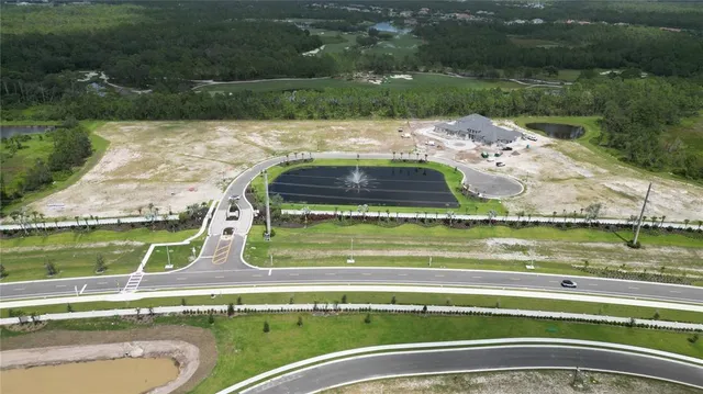 a view of a swimming pool with a yard