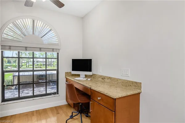 a workspace with furniture and window