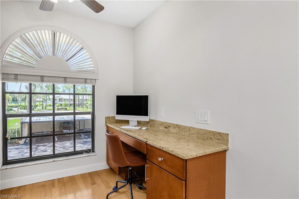 701 Augusta Boulevard, Unit 7018 Naples, FL 34113 - Photo 13 of 30 a workspace with furniture and window