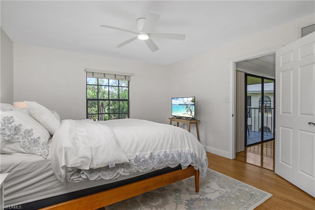 701 Augusta Boulevard, Unit 7018 Naples, FL 34113 - Photo 16 of 30 a bedroom with a bed and a window