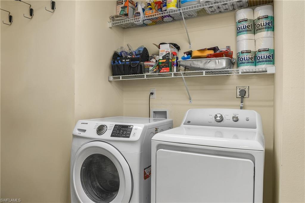 701 Augusta Boulevard, Unit 7018 Naples, FL 34113 - Photo 21 of 30 a utility room with dryer and washer