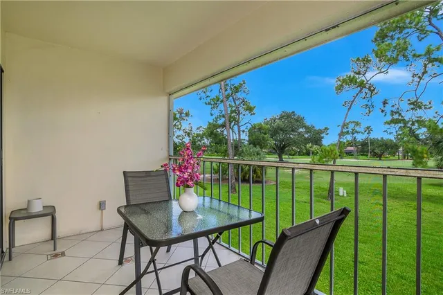 a view of a balcony with furniture
