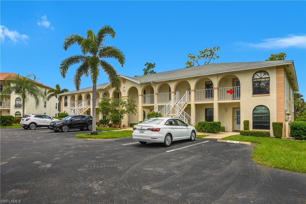 701 Augusta Boulevard, Unit 7018 Naples, FL 34113 - Photo 25 of 30 a car parked in front of a house