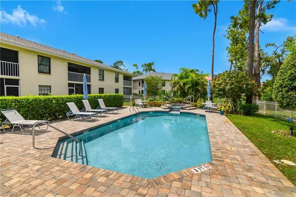 a view of swimming pool with outdoor seating