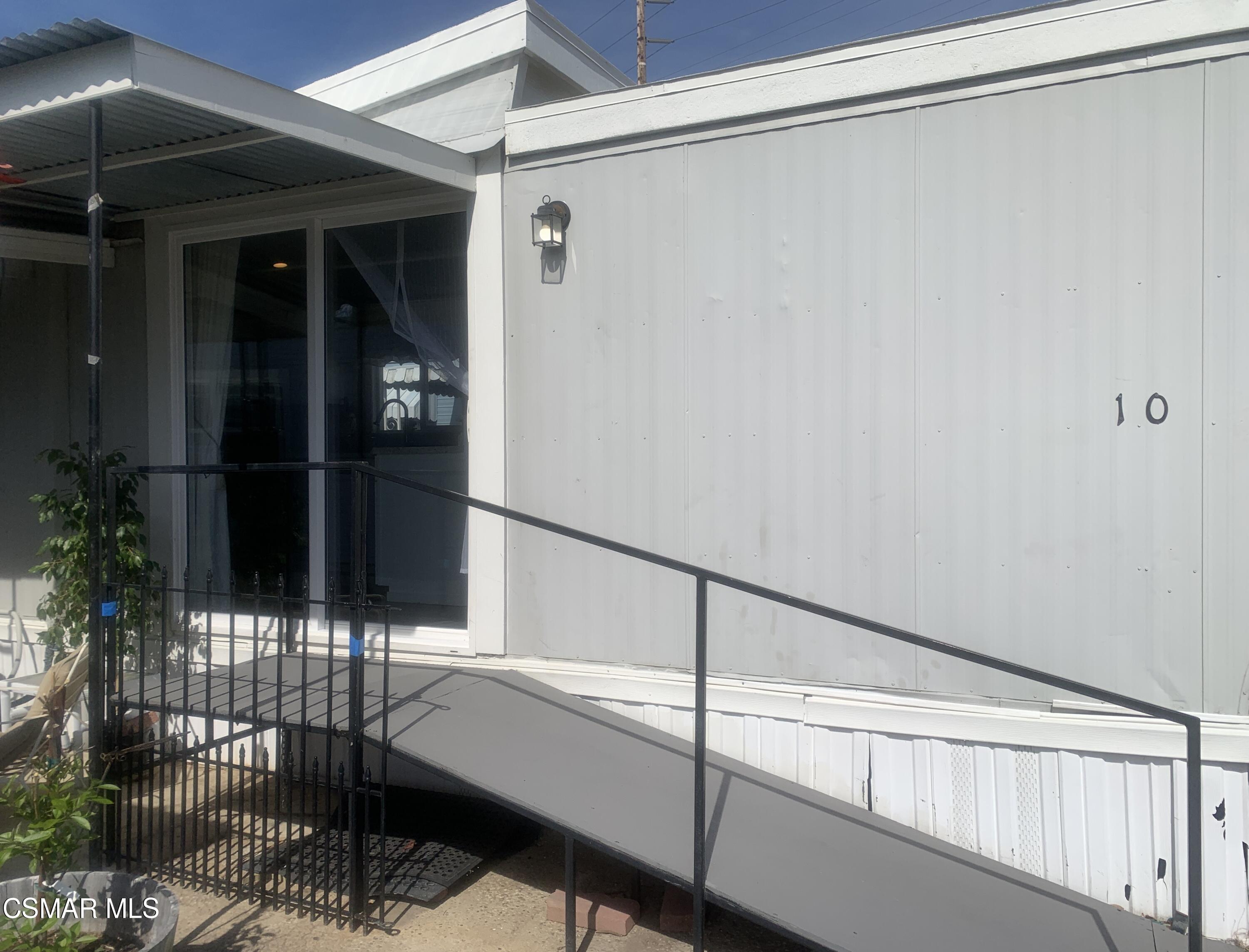 4381 Cochran Street, Unit 10 Simi Valley, CA 93063 - Photo 27 of 32 a room with a glass door shower and furniture