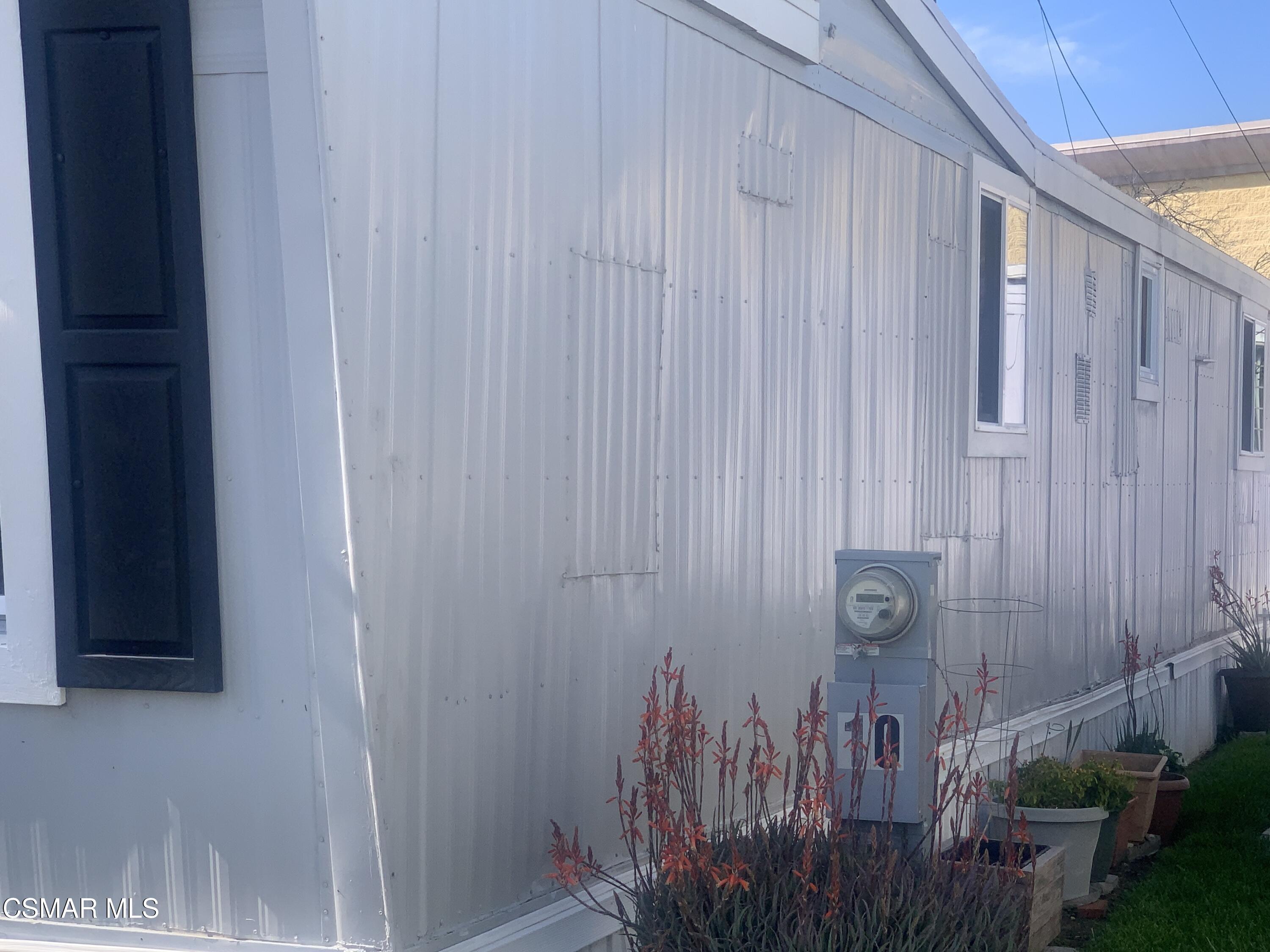 4381 Cochran Street, Unit 10 Simi Valley, CA 93063 - Photo 32 of 32 a view of a door with wooden fence