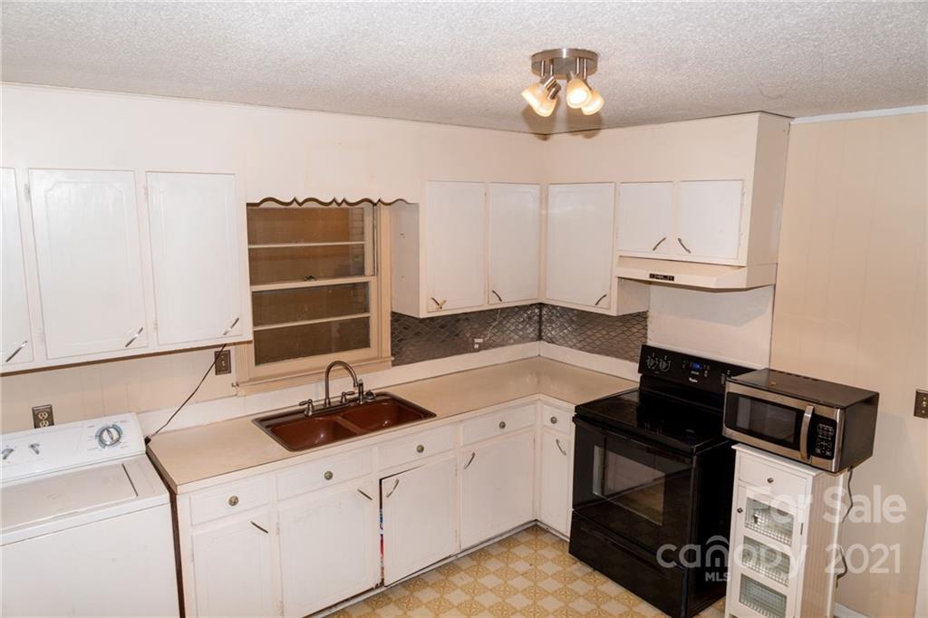 4150 McCoy Street Midland, NC 28107 - Photo 11 of 26 a kitchen with a sink and a stove top oven