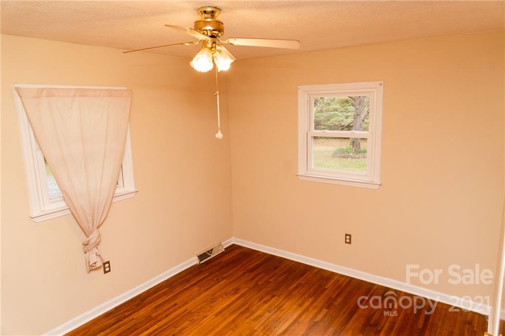 4150 McCoy Street Midland, NC 28107 - Photo 16 of 26 a view of empty room with window and wooden floor